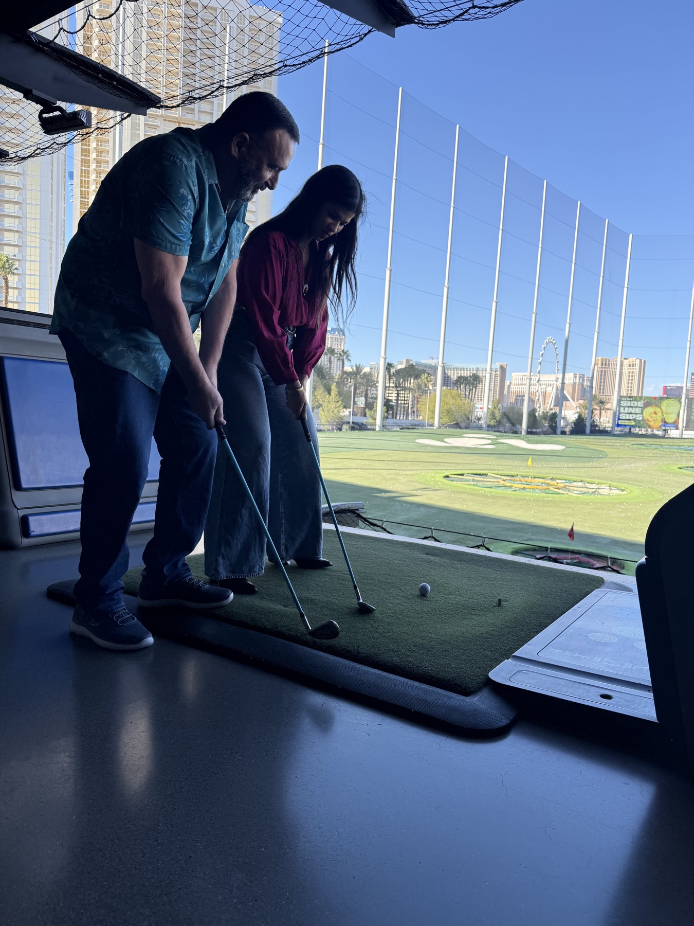Sababa helping with a golf swing