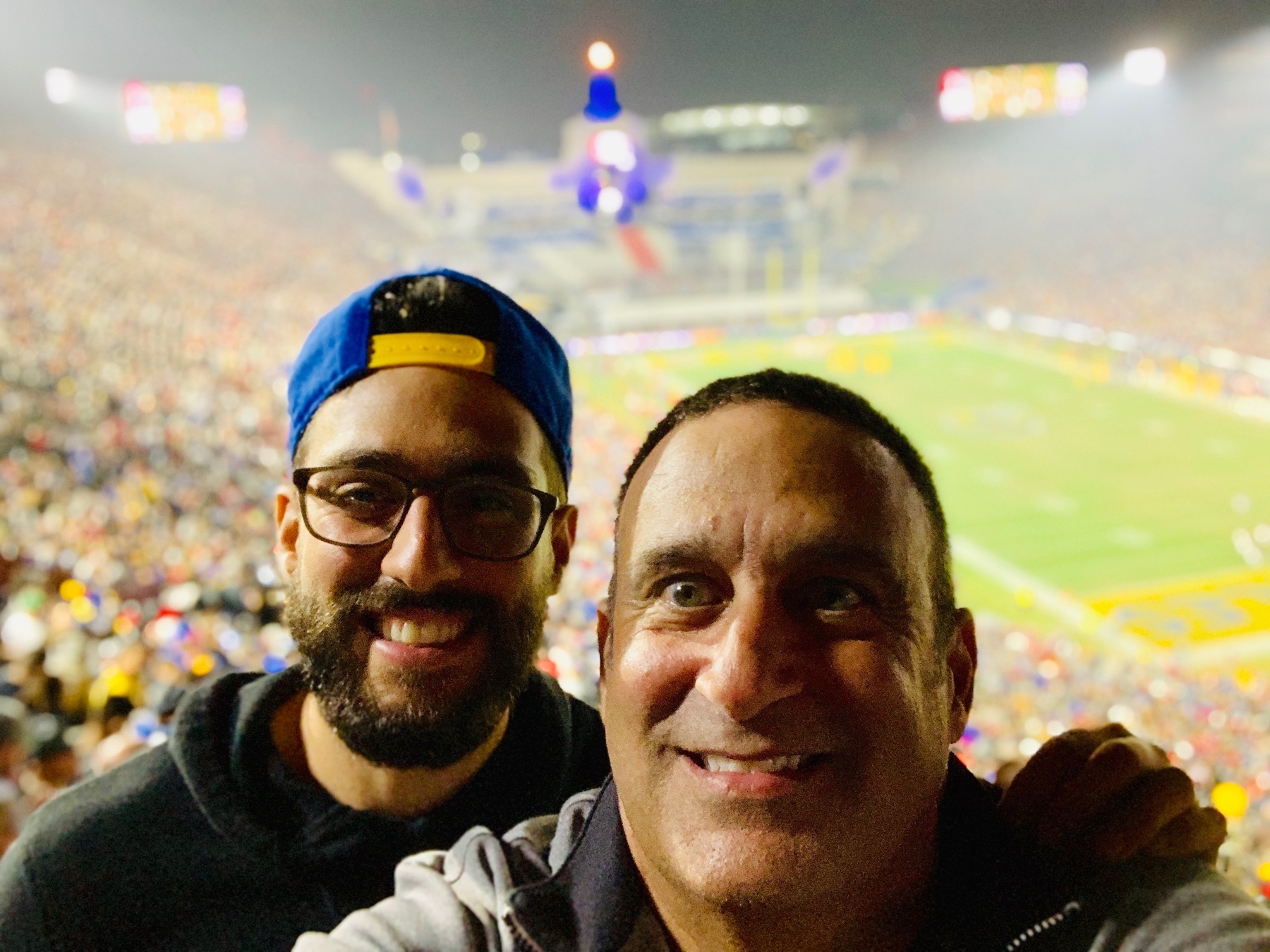 Sababa taking a selfie at a packed football stadium