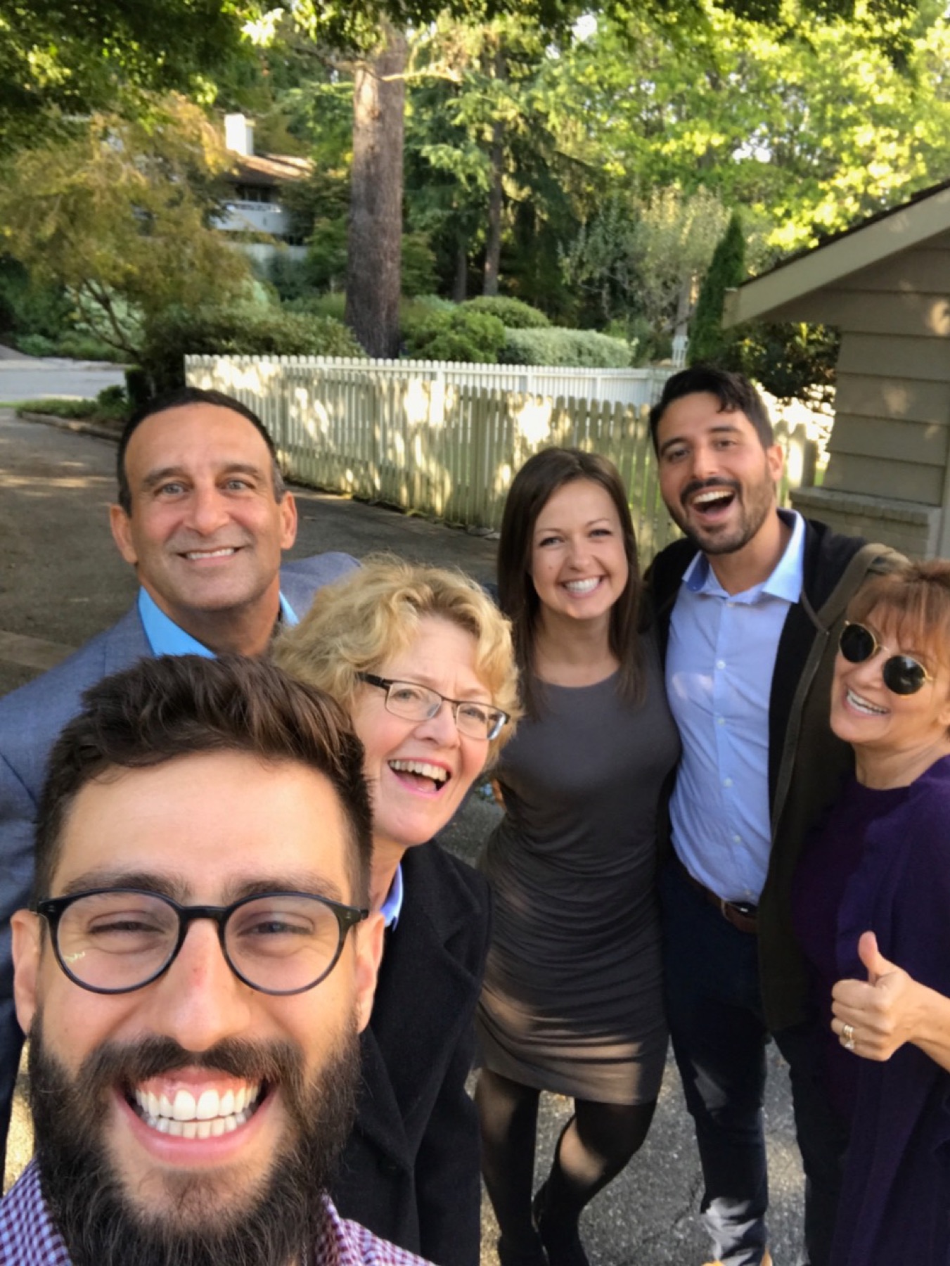 Alan and family crowding together for a cheerful selfie