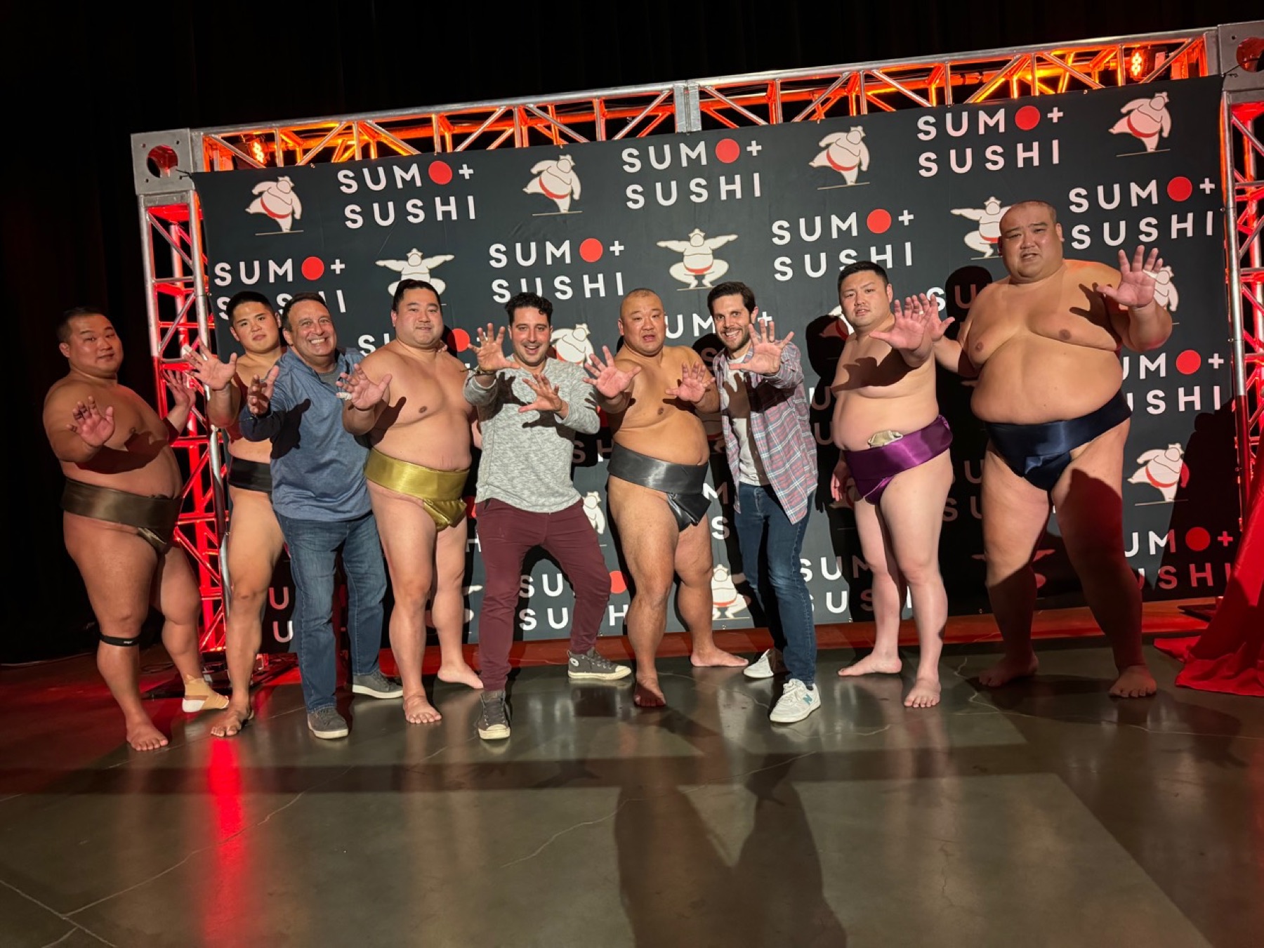 Alan and family posing with sumo wrestlers